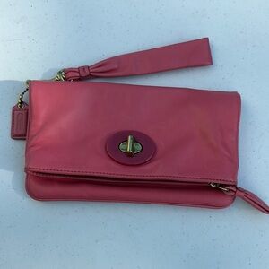 Resort punch pink wristlet 
100% Leather Coach Wristlet